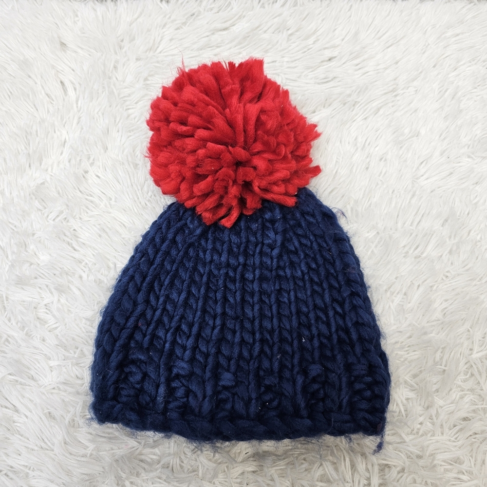 BCBGeneration blue and red knit pom pom beanie.